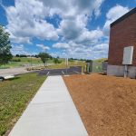 follow the sidewalk to the main entrance of the center